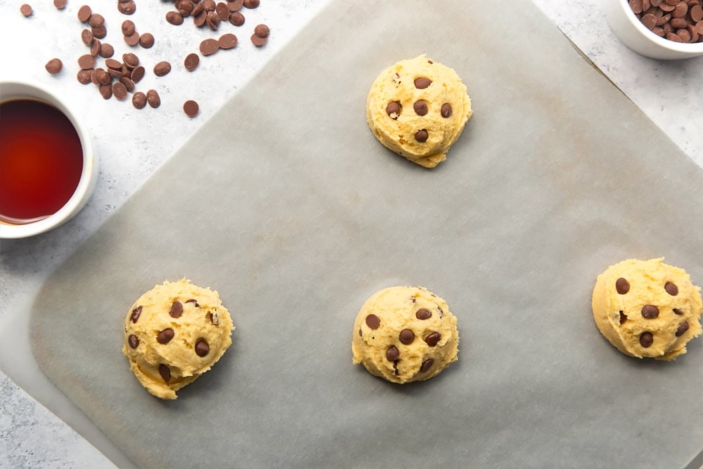 Additional chocolate chips added to each of the four dairy free chocolate chip cookies