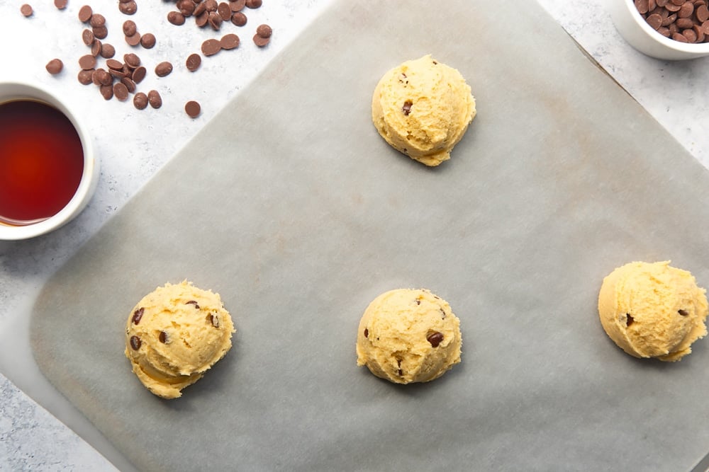 four balls of dairy free chocolate chip cookies dough