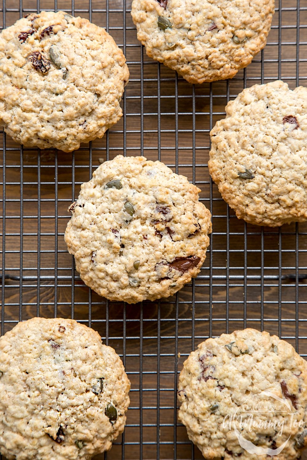 Vegan oat cookies cooling on a wire rack.