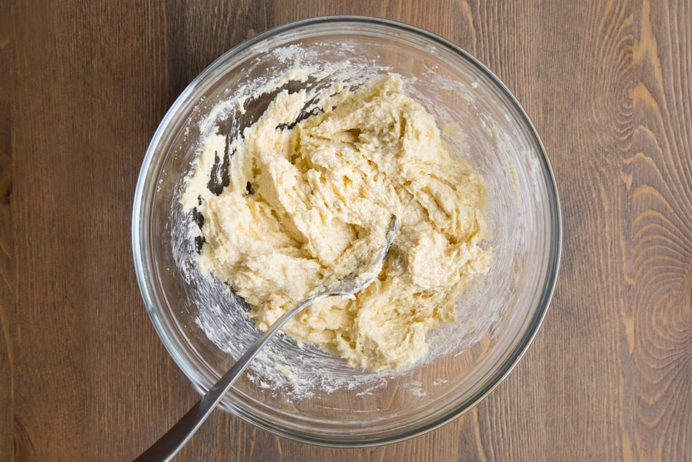 Butter and sugar creamed together in a bowl.