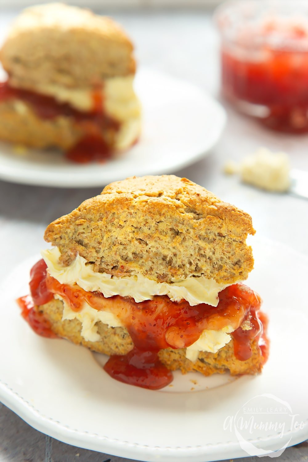 Close up of 50/50 scones with jam and cream