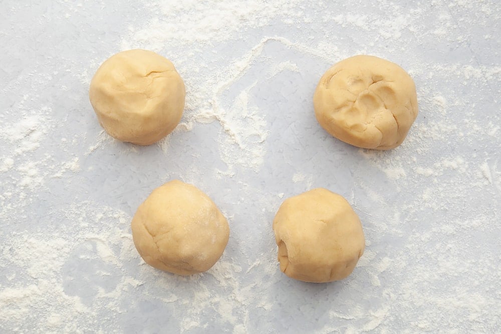 Four balls of dough, ready to make into pastry pies