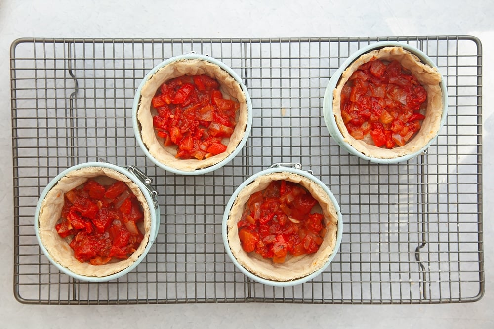 Filling the pastry cases with lasagne mix