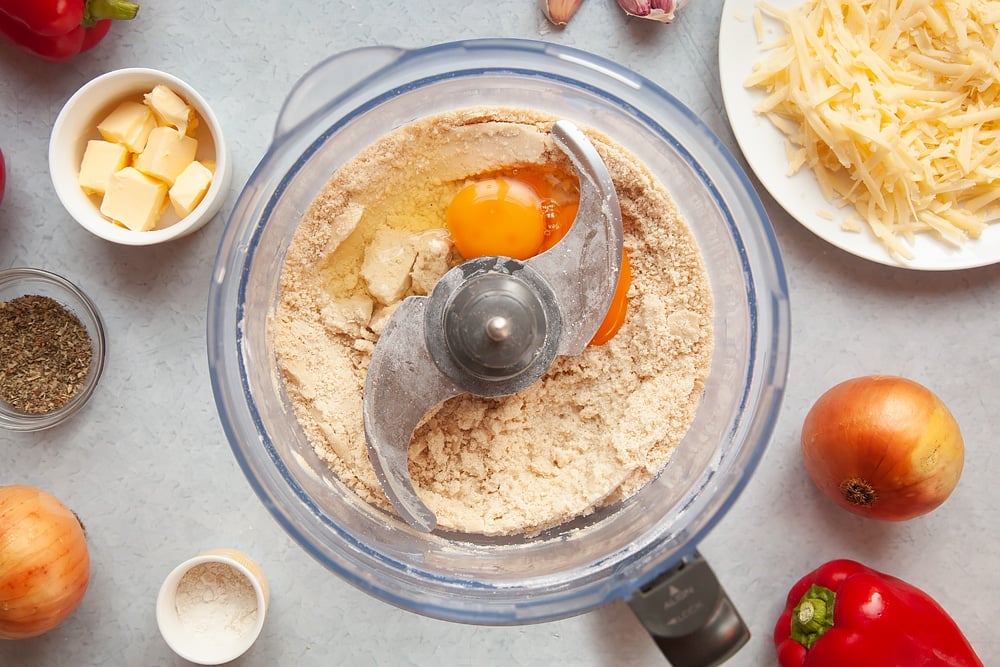 Adding eggs to the pastry mix