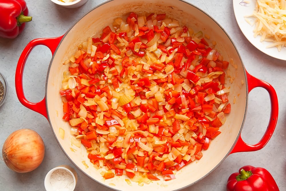 Cooking pepper, onion and garlic in a large pan