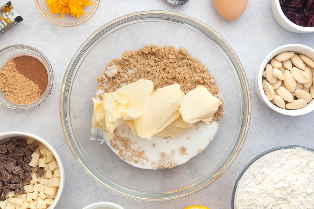 Overhead shot of sugar and margarine in a mixing bowl
