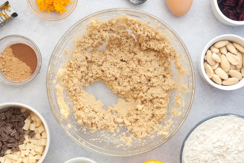 Overhead shot of sugar and margarine mix in a large clear bowl