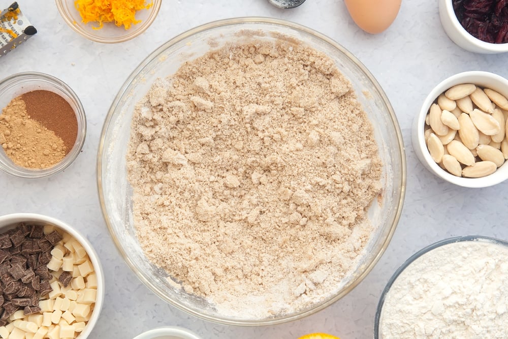 Overhead shot of dough mix in a large clear bowl