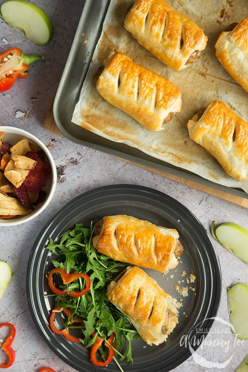 Quick vegetarian sausage rolls baked and arranged on a plate with salad