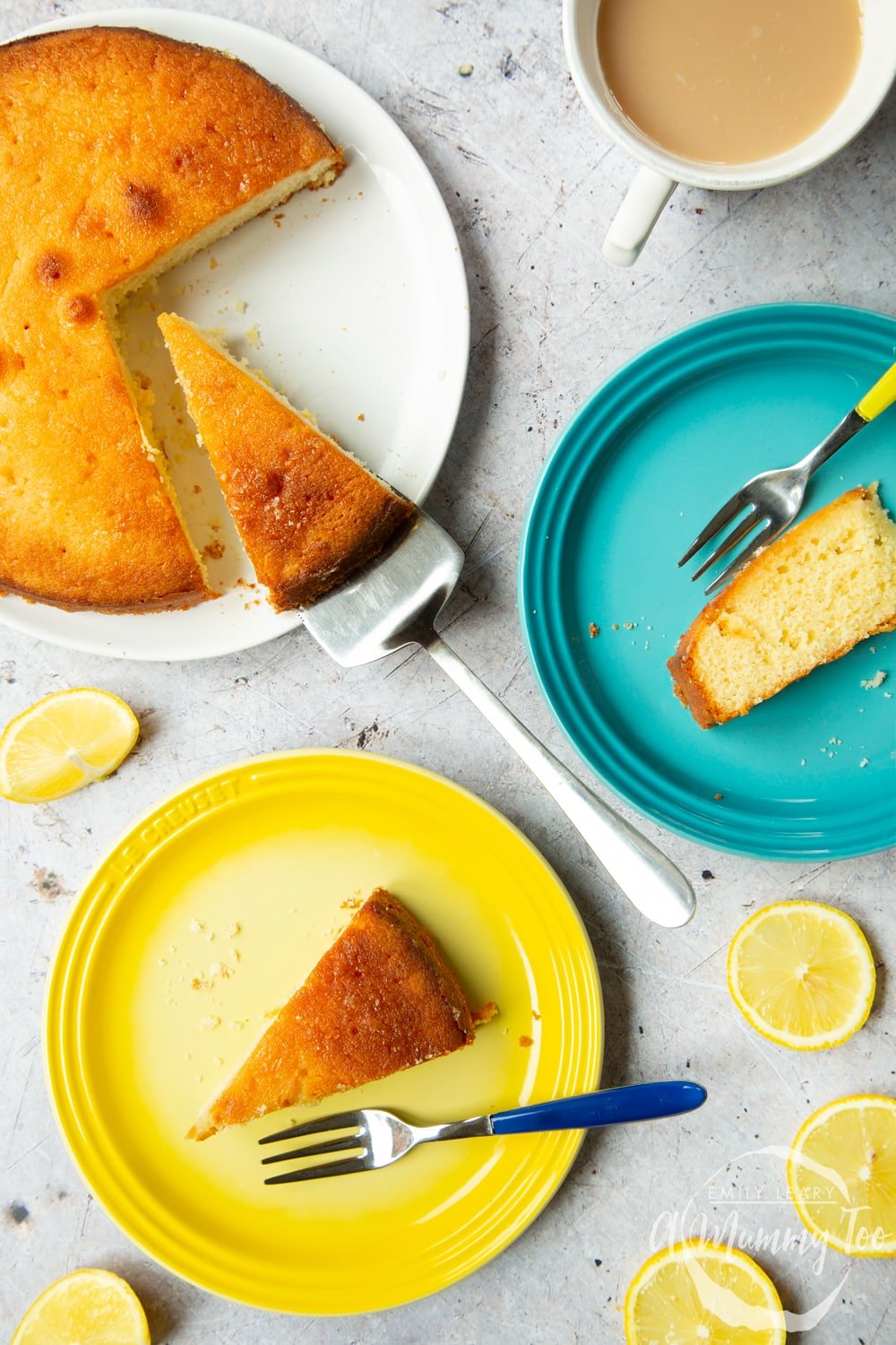 Serving slices of lemon drizzle cake