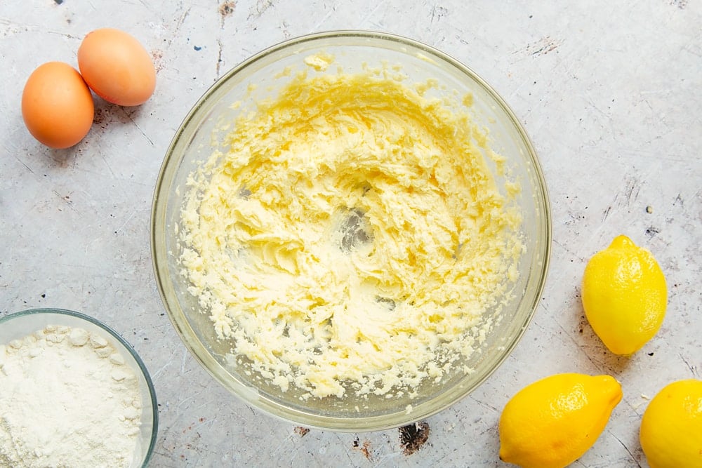 Cream sugar and butter together in a mixing bowl