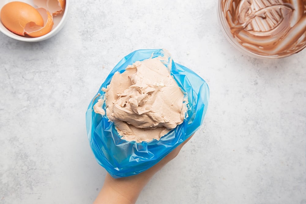 Overhead shot of the frosting inside a piping bag. 