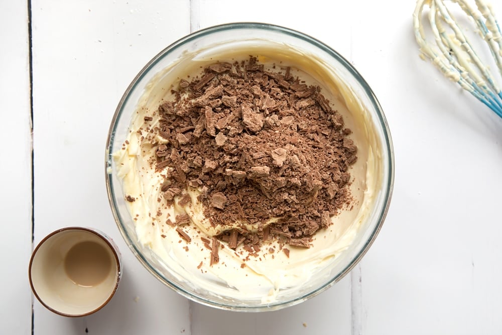 Cream, icing sugar, cream cheese and Baileys combined in a mixing bowl. Chocolate added.