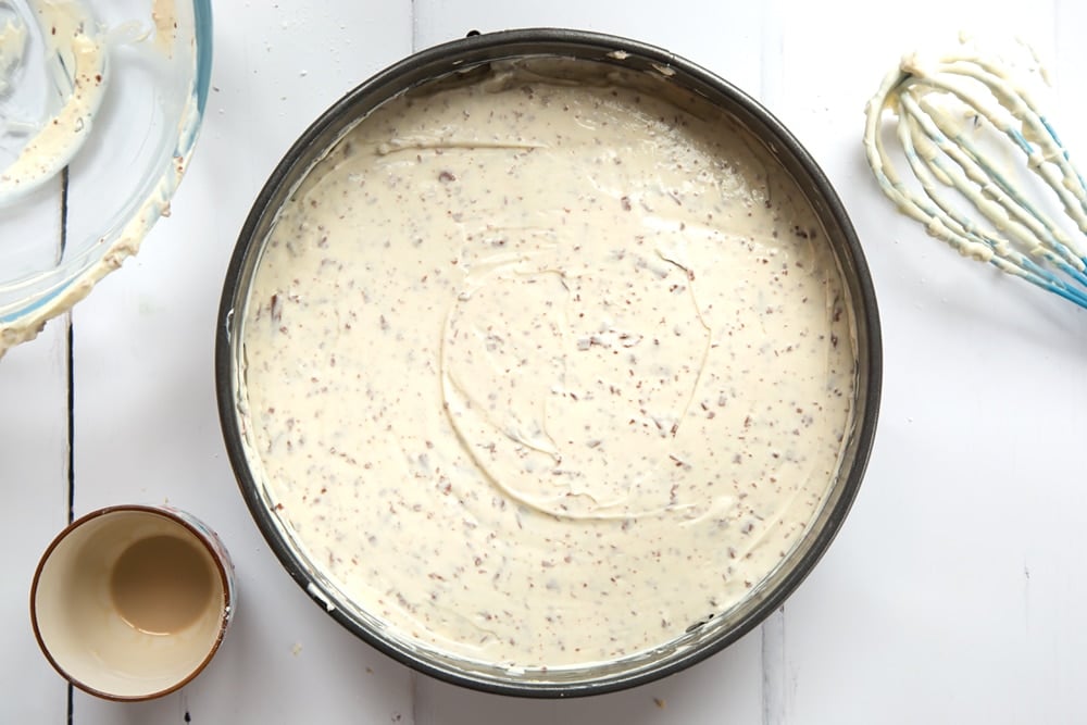 Cream, icing sugar, cream cheese, Baileys and chocolate spread on top of the biscuit base.