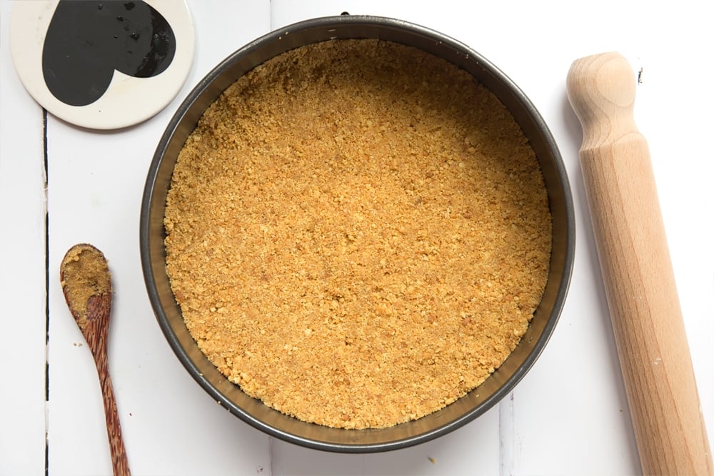 Biscuit base in a baking tin.