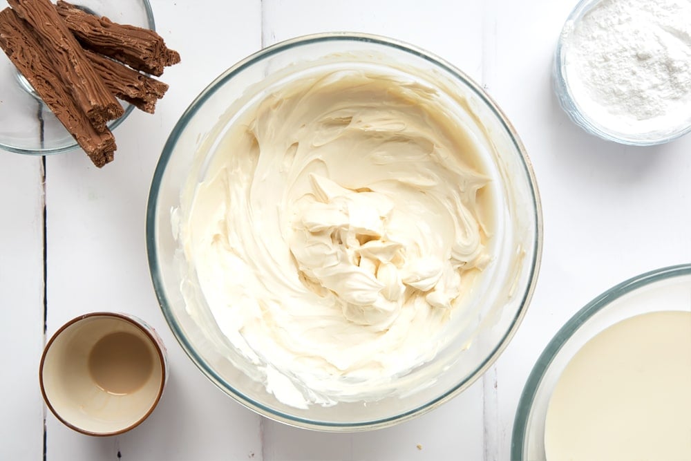 Cream cheese and Baileys combined in a mixing bowl.