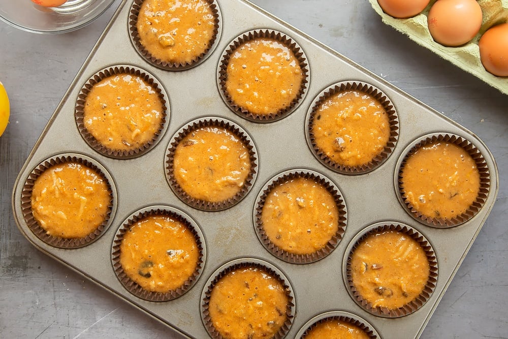 Christmas pudding muffin mix in muffin pan