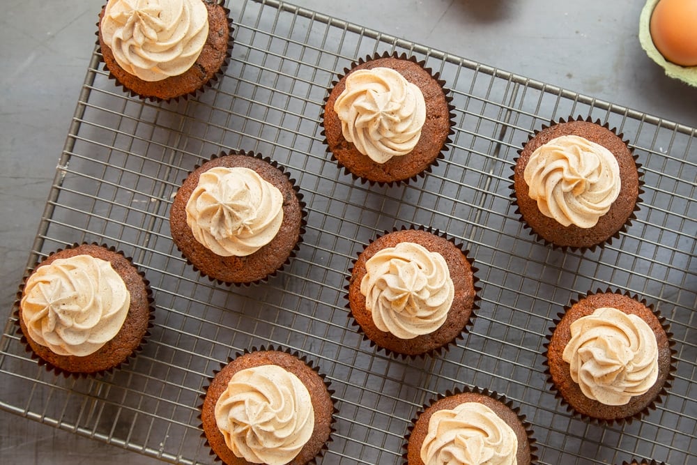 Christmas pudding muffins with piped spiced rum frosting