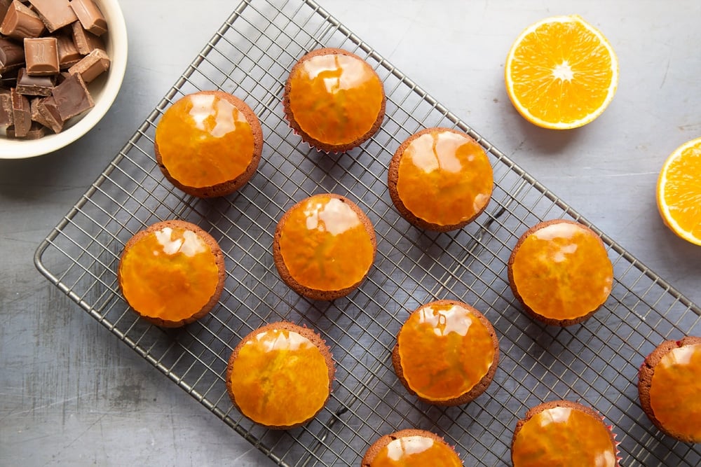 Top the cupcakes with a round of orange jelly