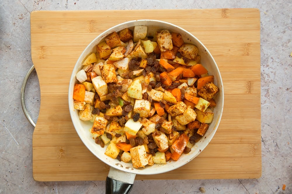 Overhead shot of vegetables in a large white pan