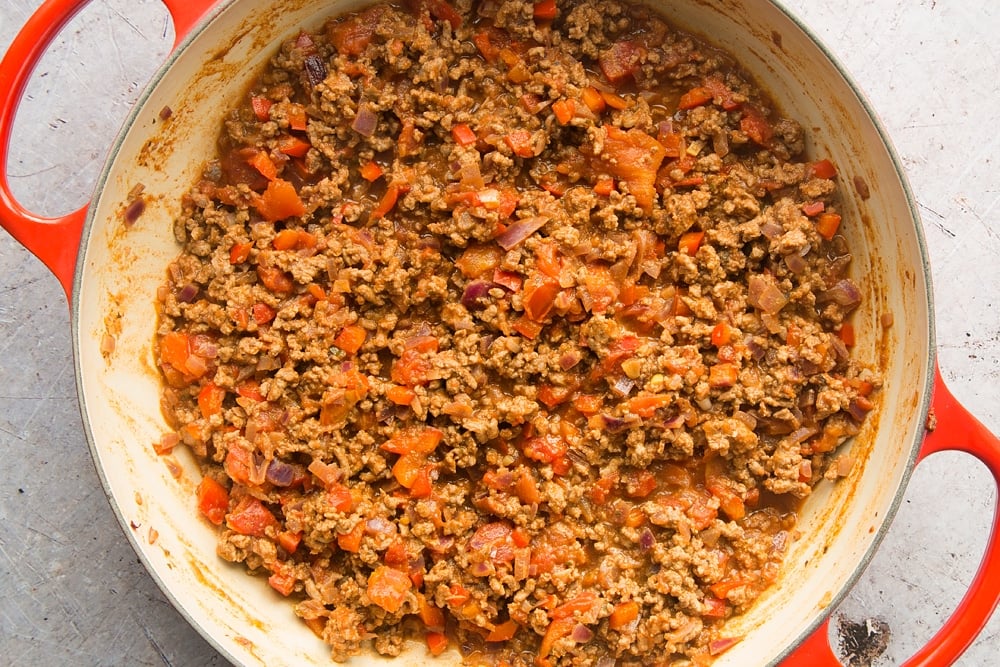 Cooked onion, red pepper, garlic, oregano and chilli powder, beef mince with chopped tomato sauce.