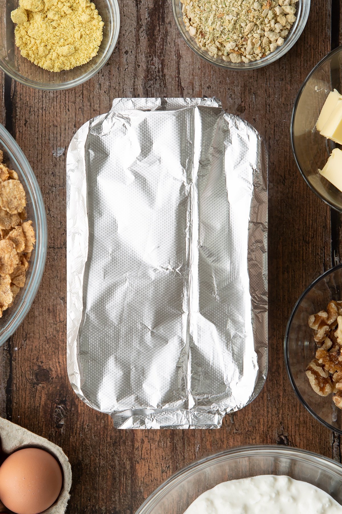 Overhead shot of the loaf tin overed with foil before going in the oven.