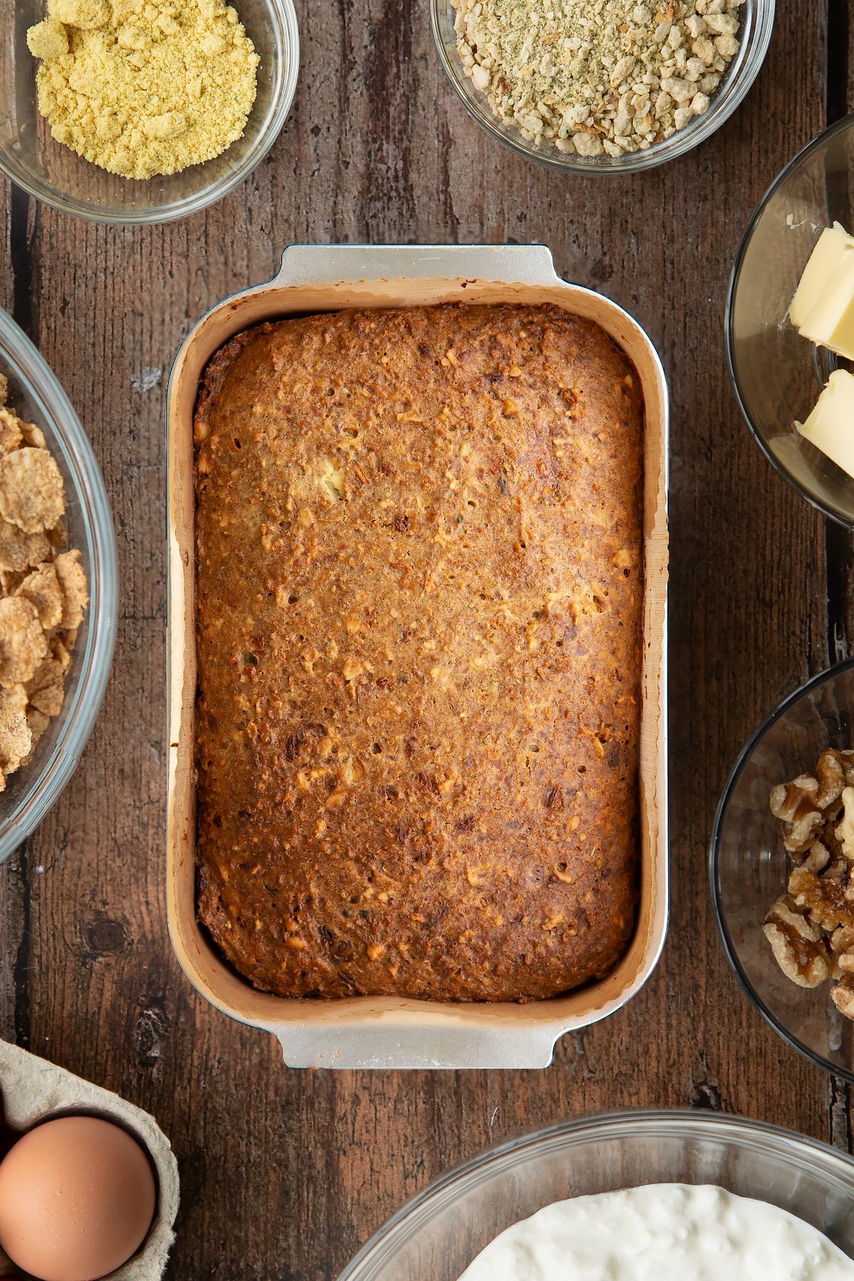 Overhead shot of the special k loaf inside a loaf tin having been in the oven. 