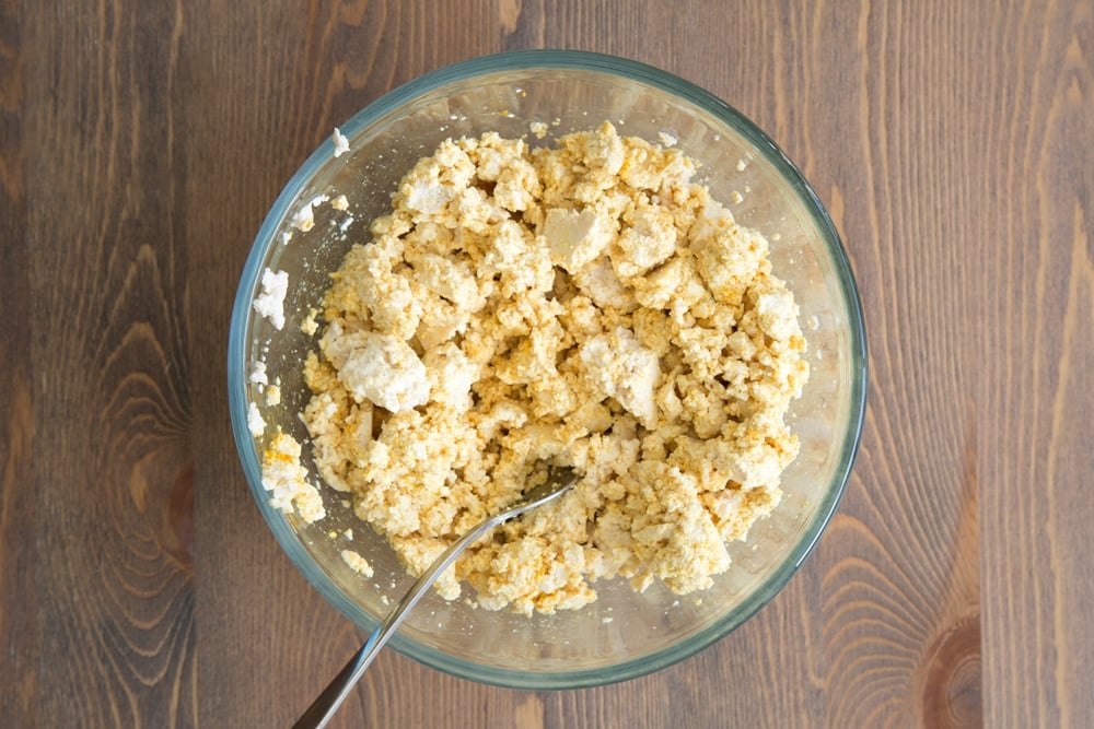 Mashing the vegan scrambled egg ingredients together