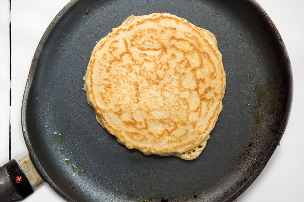 Super fluffy vegan american pancake in a frying pan