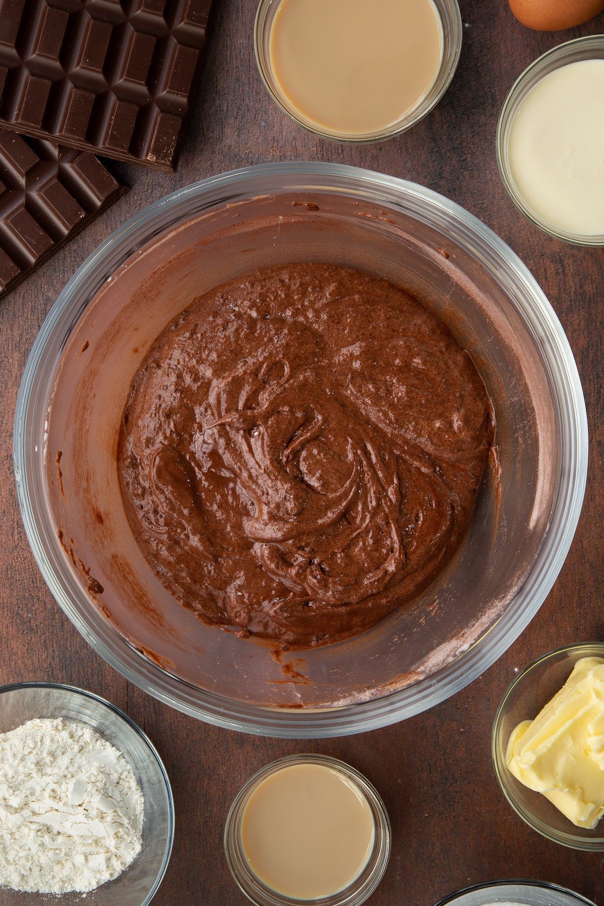 melted chocolate baileys cake mix in a large clear bowl.