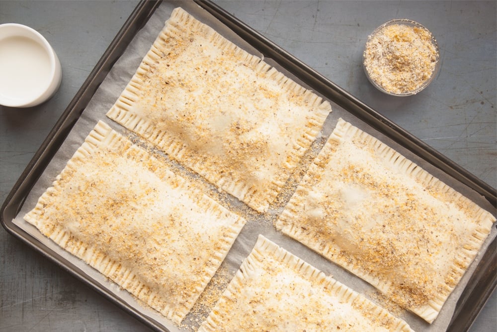 Brush with milk and top with sage and breadcrumbs