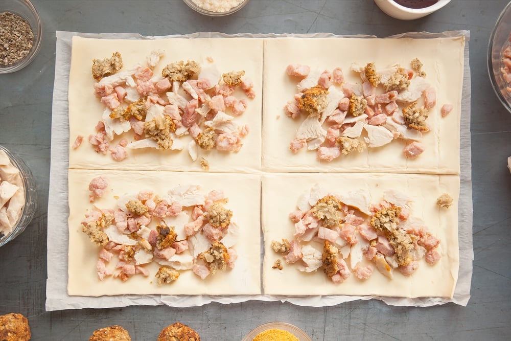 Adding bacon turkey and stuffing to the pastry rectangles. 