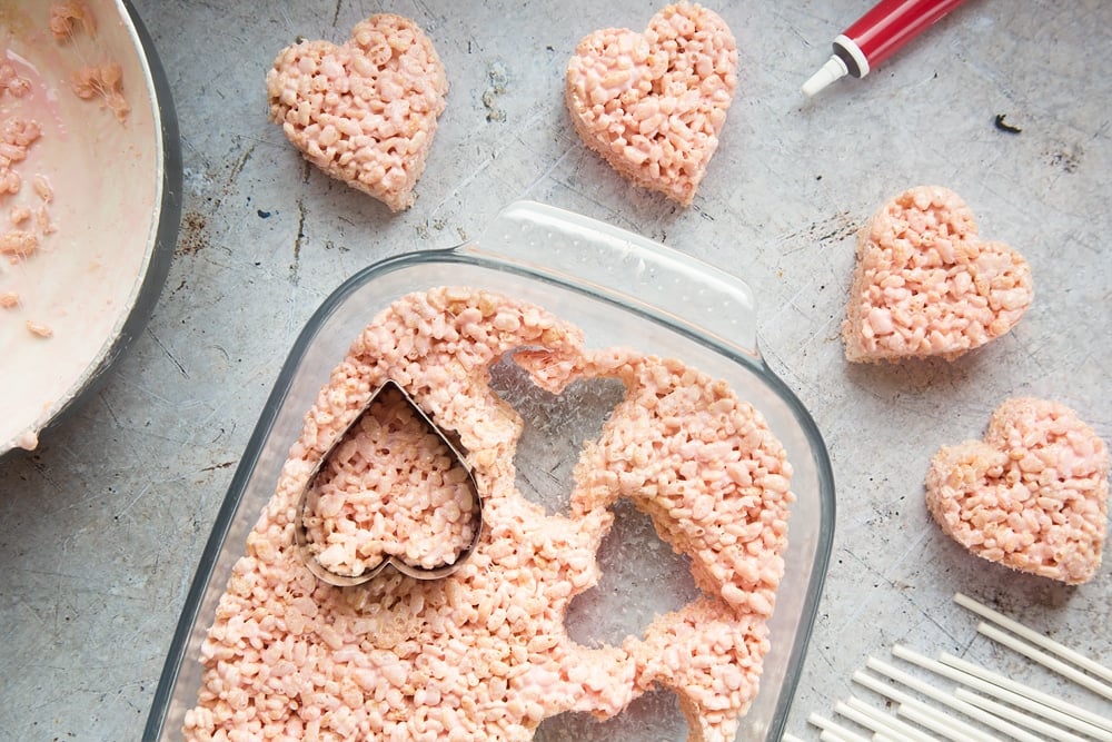 Use heart shaped cookie cutters to cut out the heart crispy cake pops