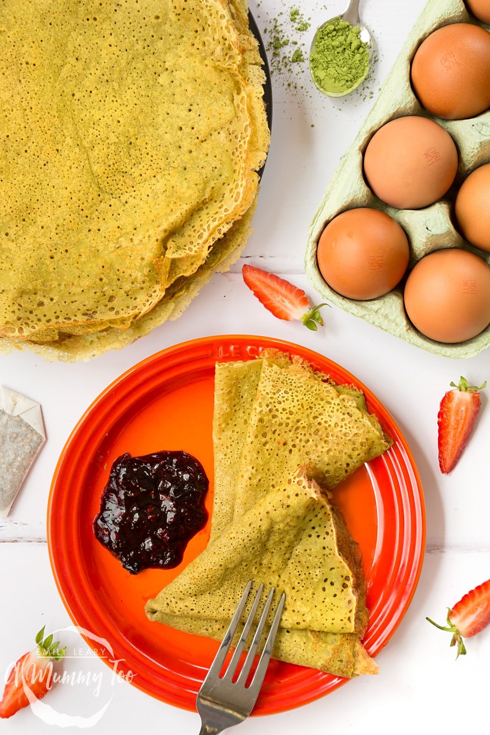 Delicate matcha pancakes, flavoured with matcha tea and served with a homemade berry sauce