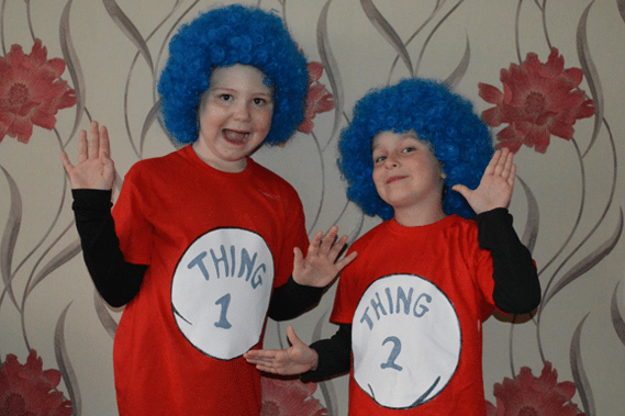 two kids wearing thing 1 and ting 2 t-shirts.