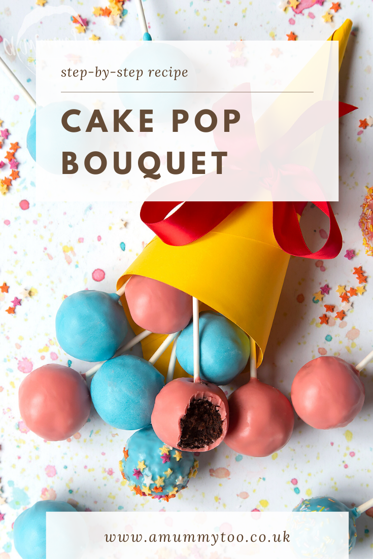 A cake pop bouquet surrounded by other cake pops. The bouquet is made from several blue and pink cake pops, gathered together and wrapped in a yellow paper cone with a red ribbon. One of the cake pops has a bite taken out of it, showing the chocolate sponge filling inside. Caption reads: step-by-step recipe cake pop bouquet