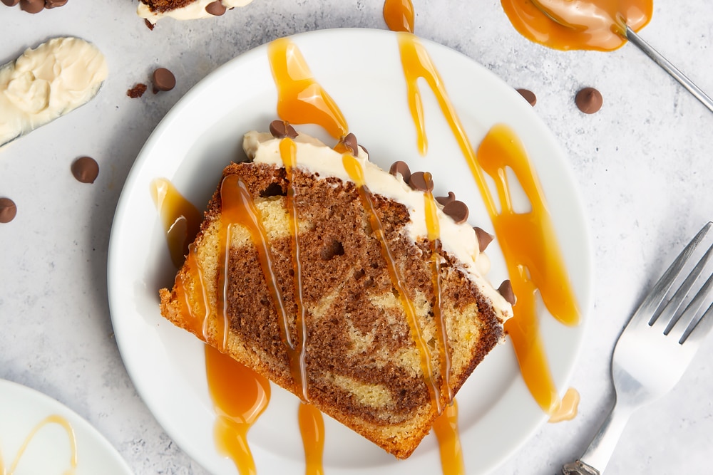 Sliced chocolate marble cake drizzled with warmed salted caramel sauce