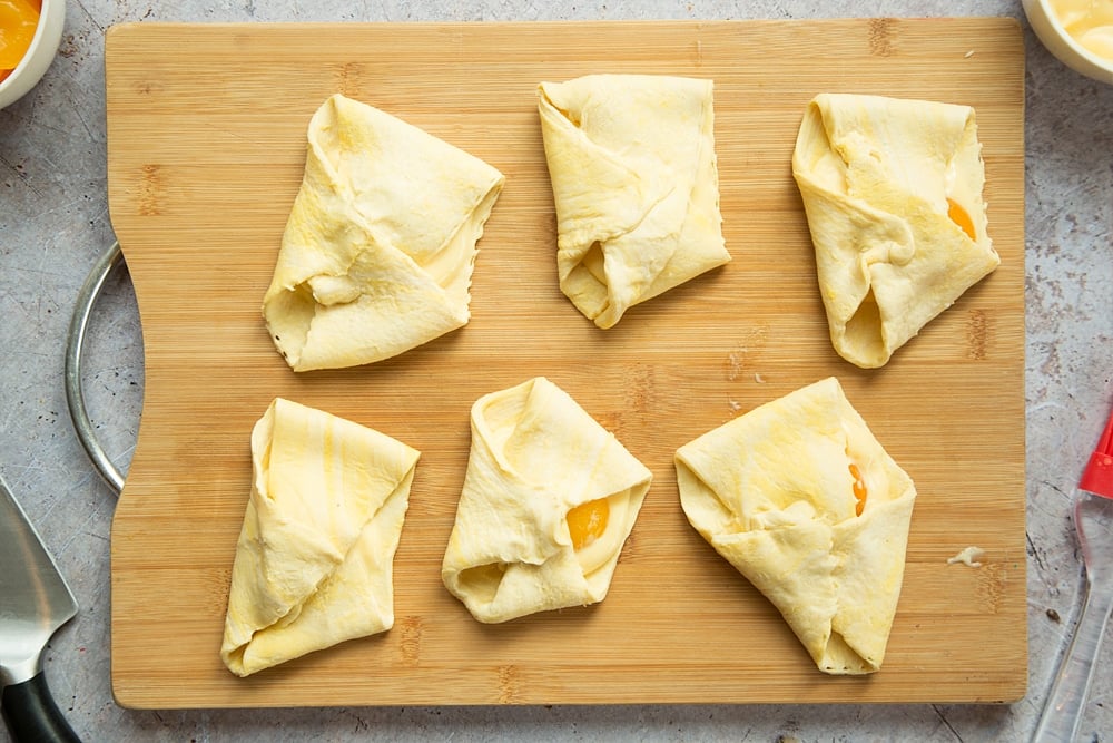 Six apricot pastries ready to bake