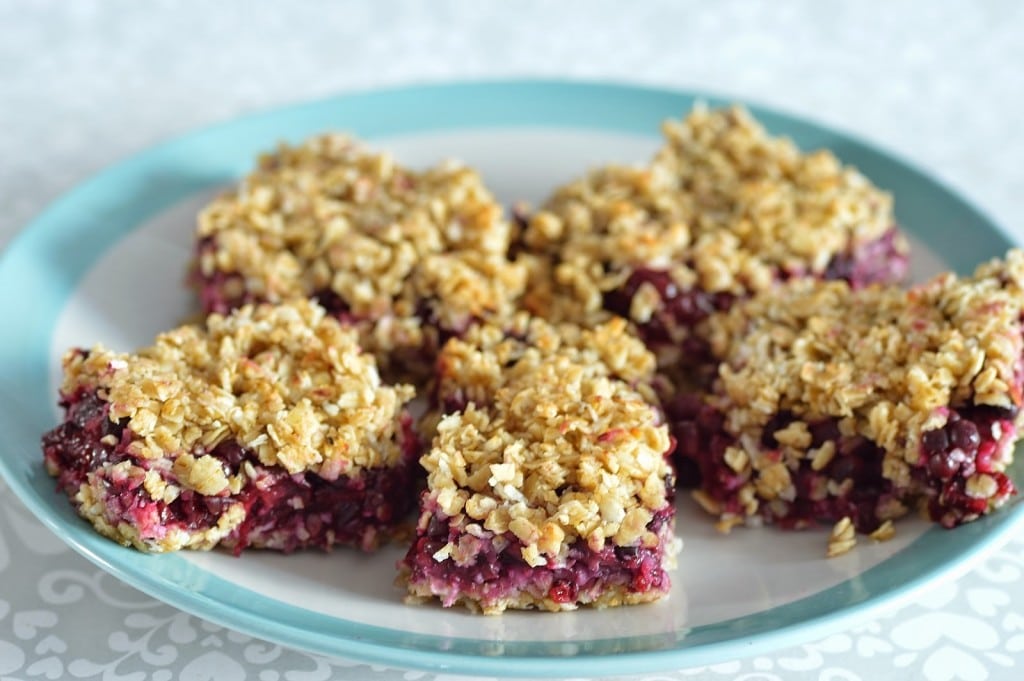 Slices of Blackberry Flapjacks on a white and blue plate