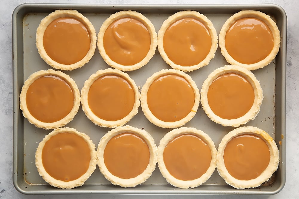 Spoon salted caramel into your pastry cases