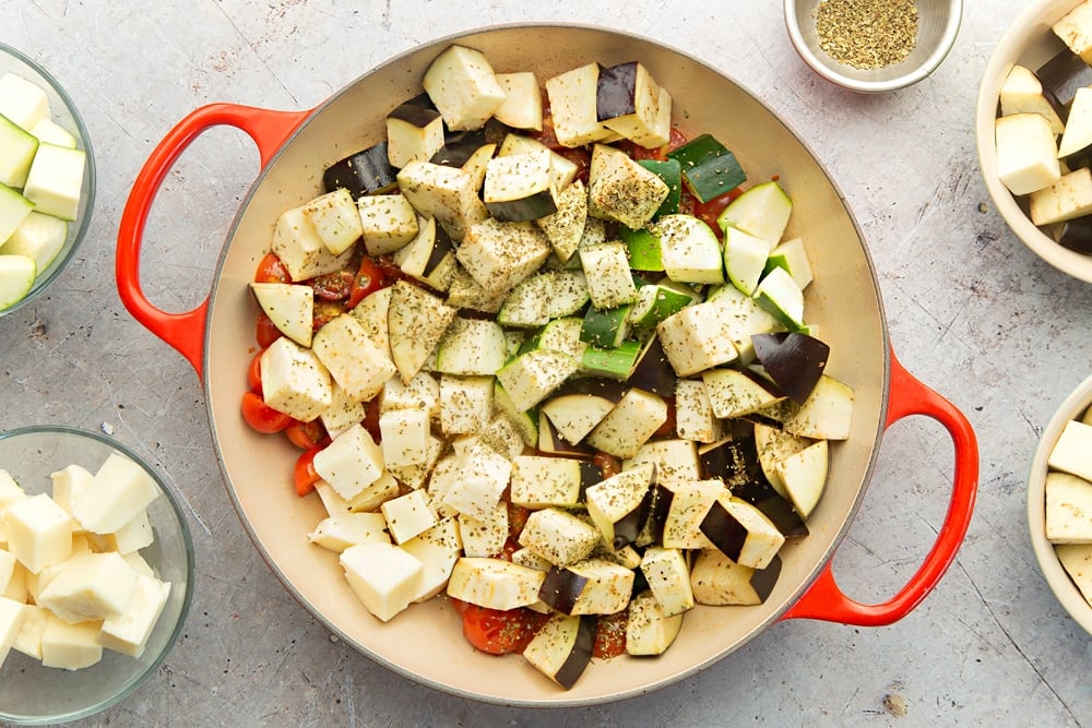 Aubergine, courgette, halloumi and herbs are added to the frying pan