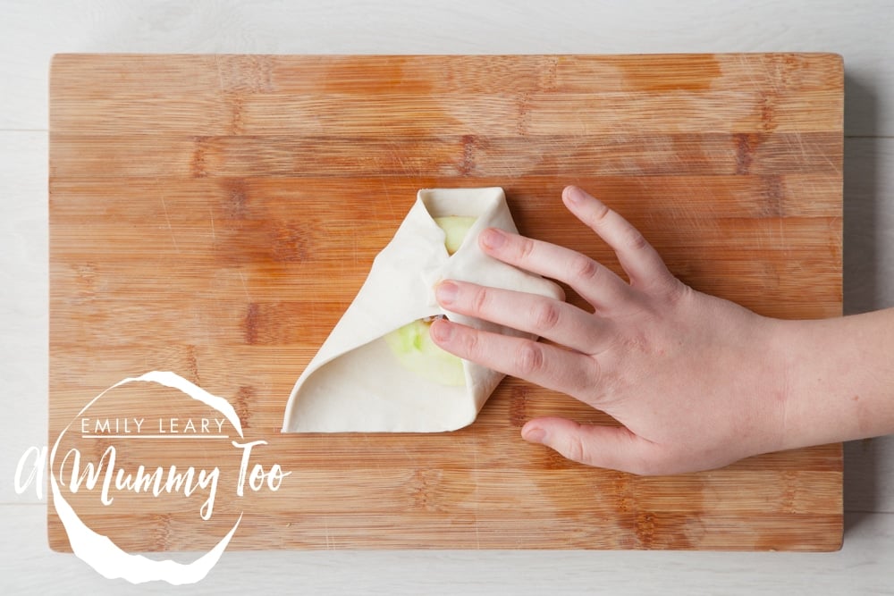 Wrapping the apples in puff pastry