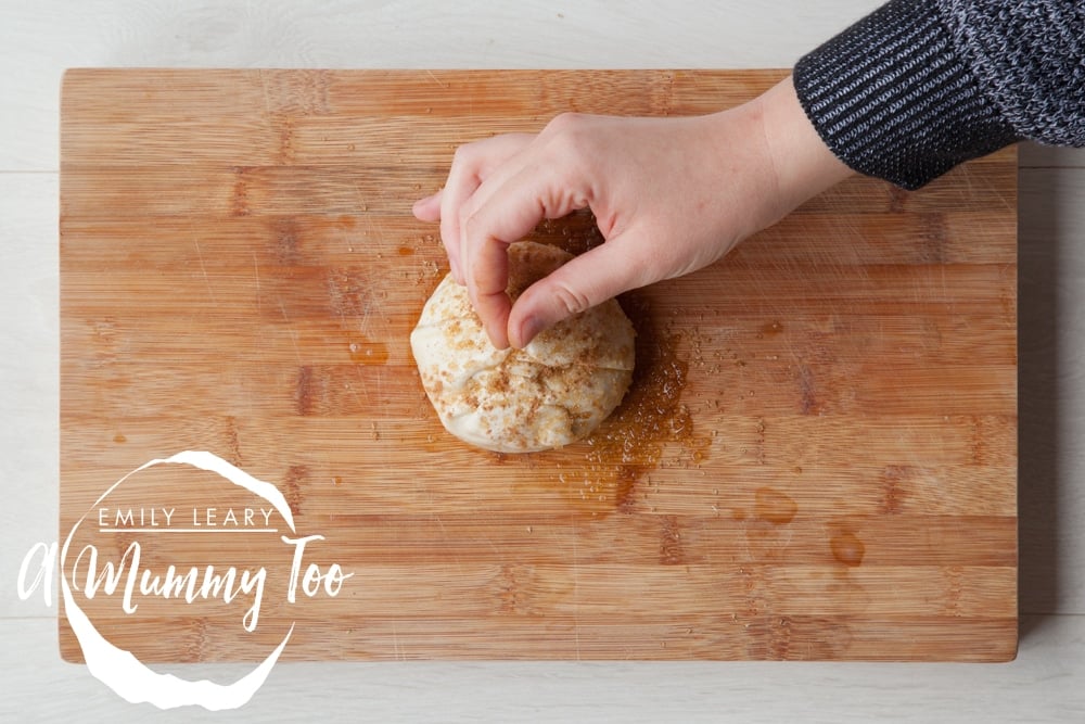 mincemeat and Bramley apple puff parcels topped with a pinch of cinnamon