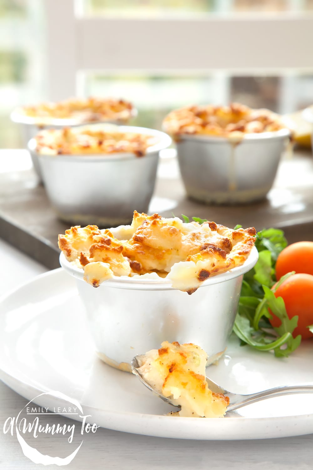 These mini cheesy fish pies are made with frozen fish pie mix, peas, cheese sauce and mashed potato