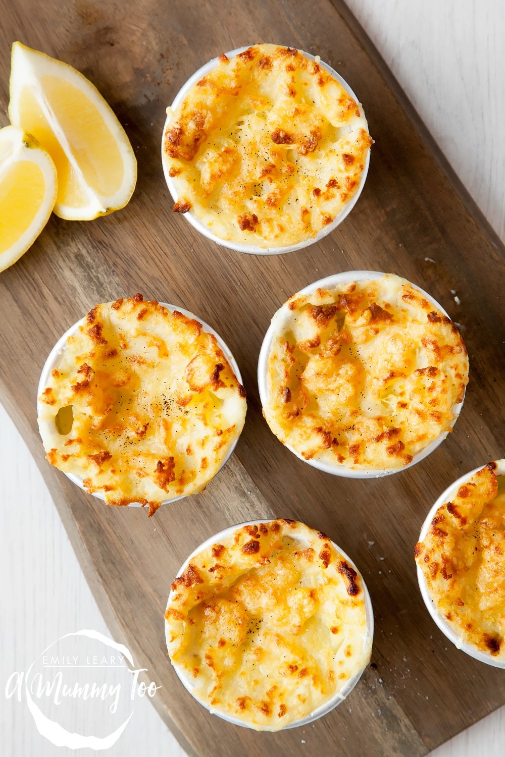 Delicious mini cheesy fish pies, shown on a serving board