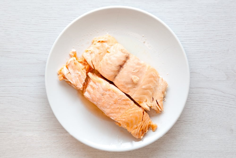 Salmon fillets on a plate ready to make the baked fish cakes without breadcrumbs