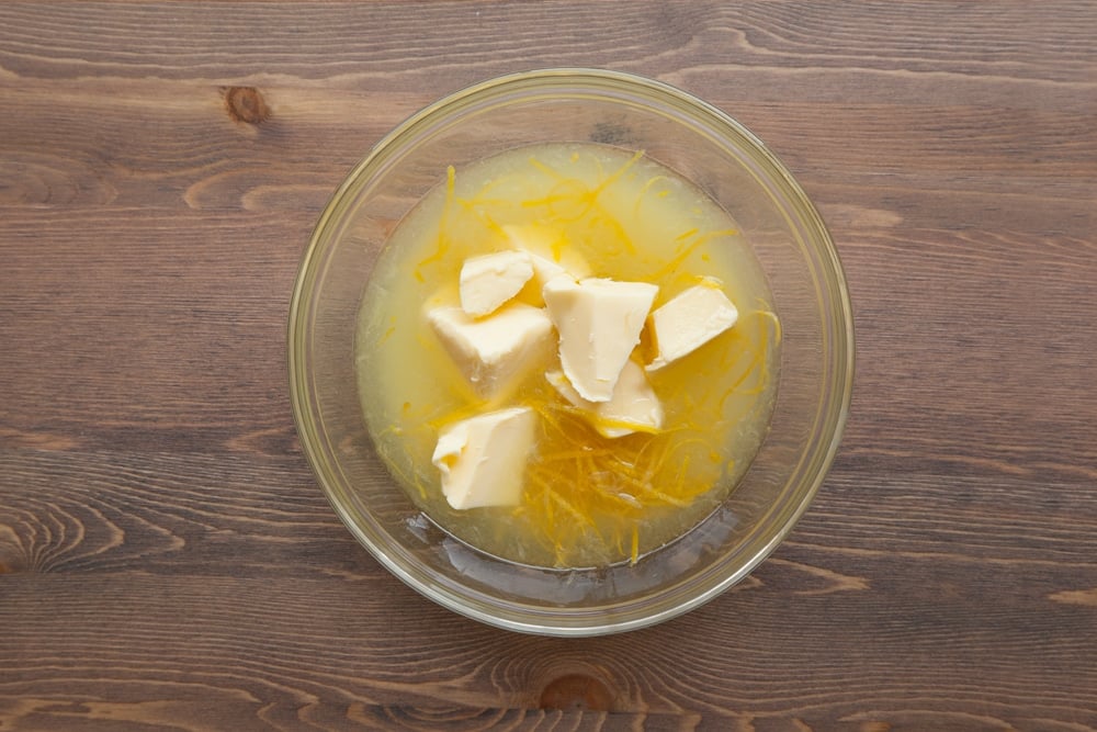 Lemon juice, lemon rind, butter and sugar in a bowl.