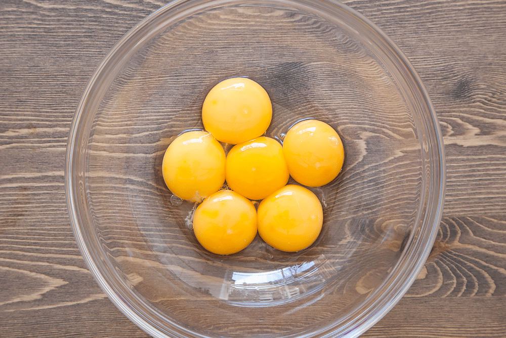 Egg yolks in a glass bowl