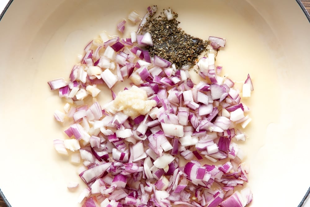 Onion, garlic and oregano in a frying pan