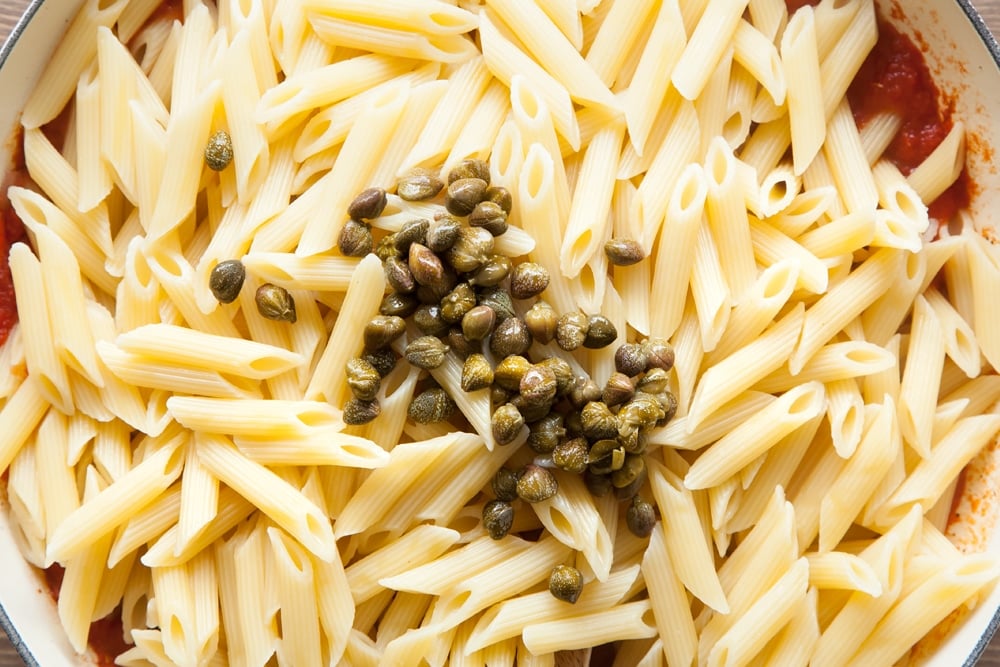 Add pasta and capers to the passata